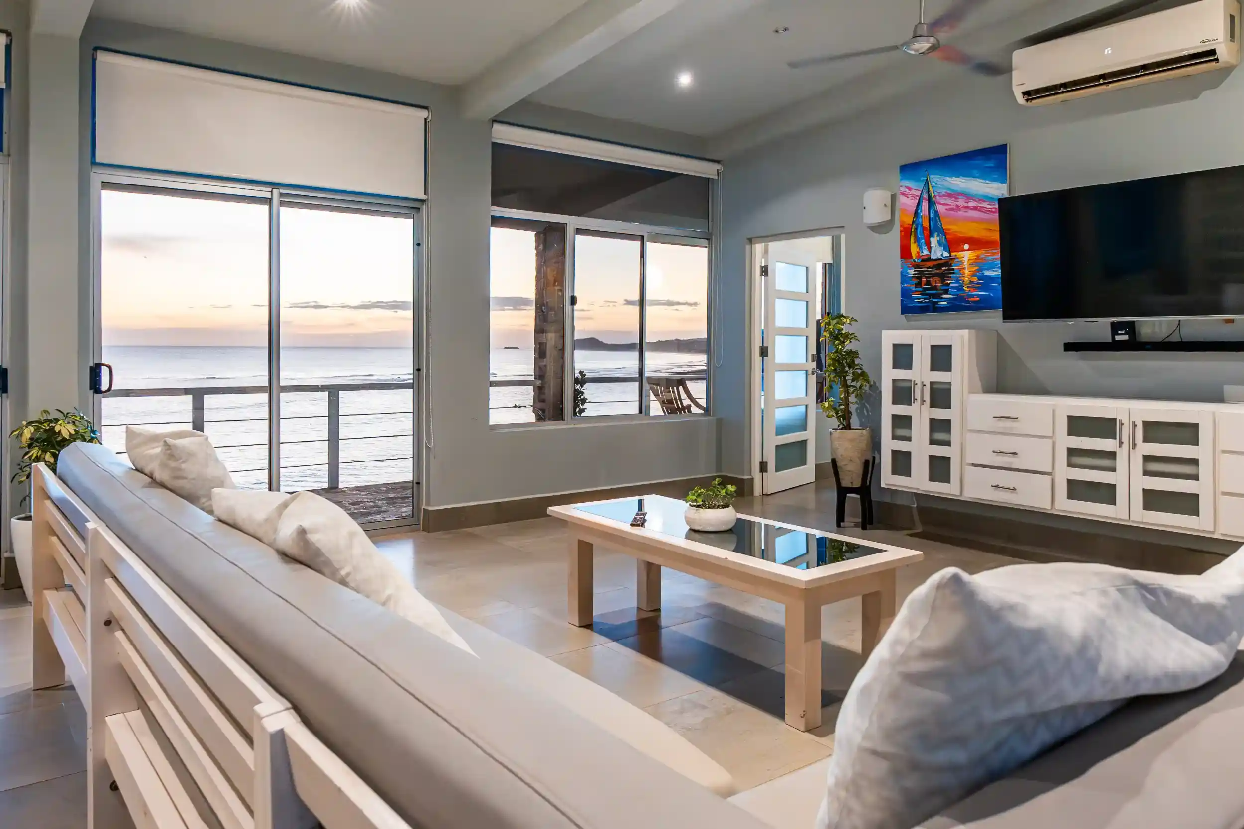 Comfortable oceanview accommodation at Magnific Rock featuring modern living spaces, seating areas,designed for yoga retreat groups in Popoyo